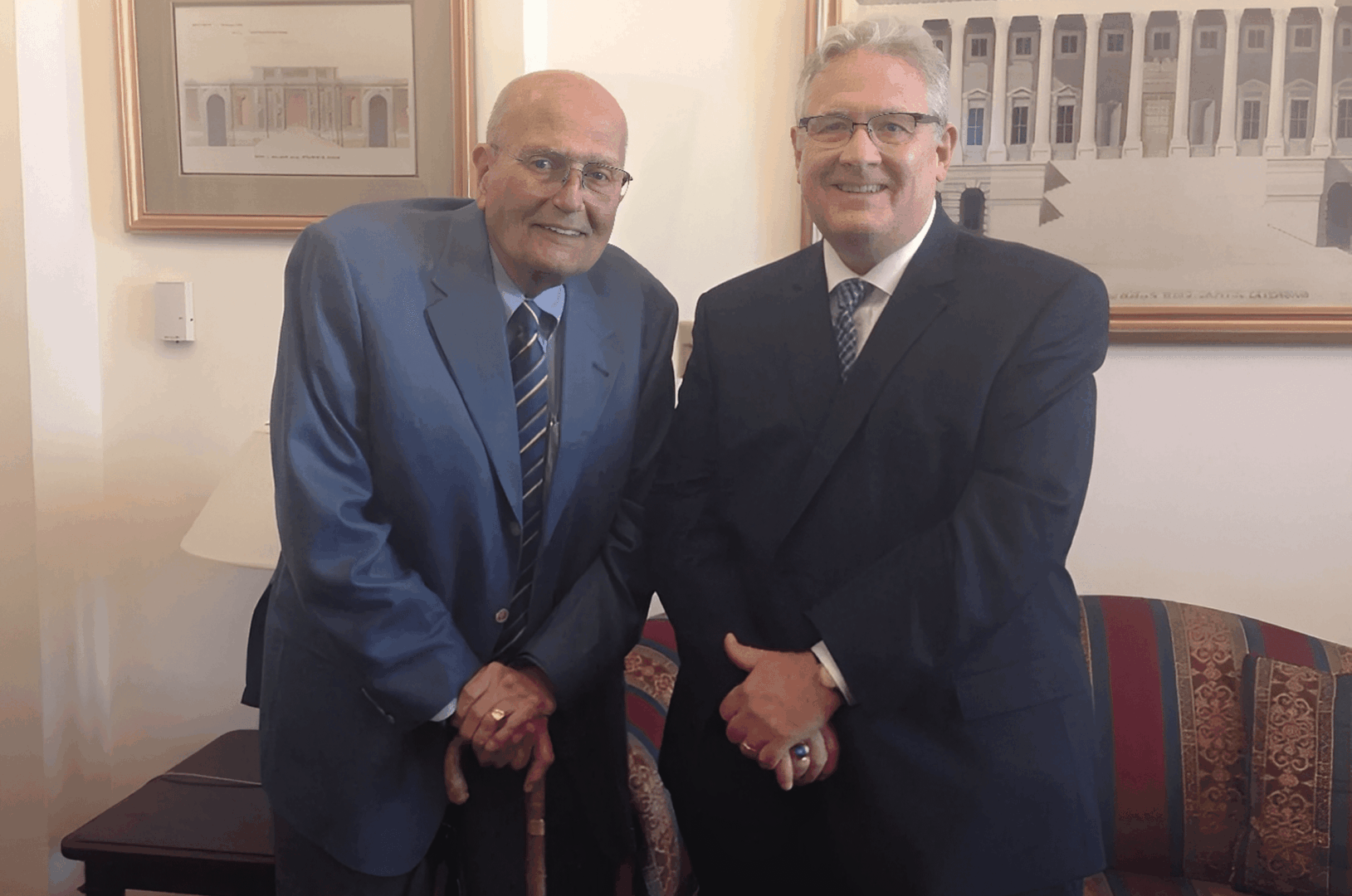 Two men standing in an office.